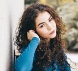 Here's What You Need To Know About Wolf Cut Curly Hair