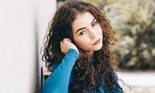 Here's What You Need To Know About Wolf Cut Curly Hair